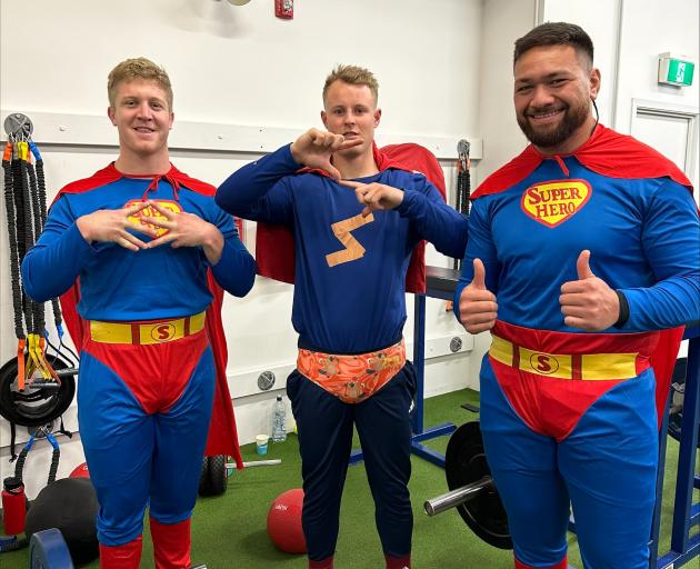 Otago rugby players (from left) Sean Withy, Sam Gilbert and Saula Ma'u dress up as superheroes....