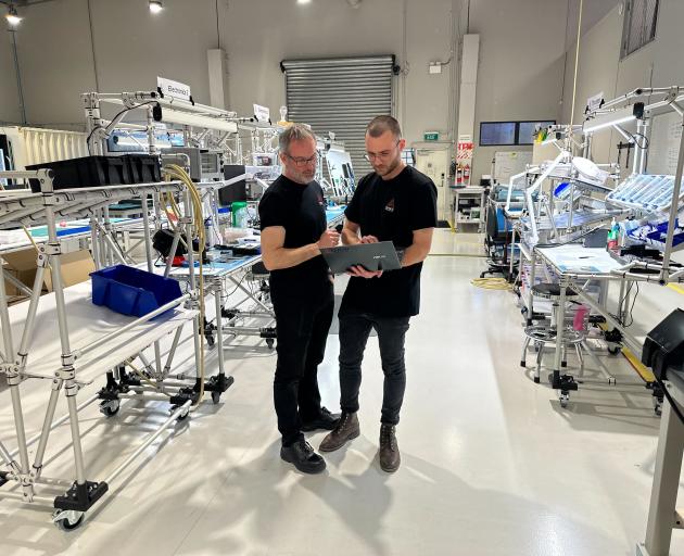 Thomas Galbraith, right, says the company he works for is proud to be helping the satellite...