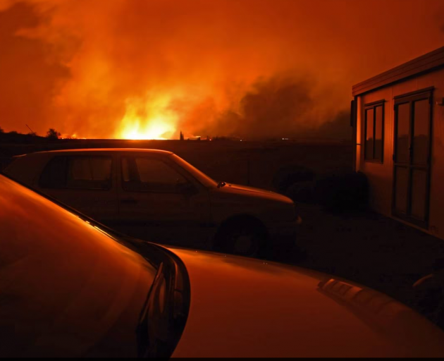 The fire came close to buildings last night. Photo: Chris Rudge, Aviation Adventures