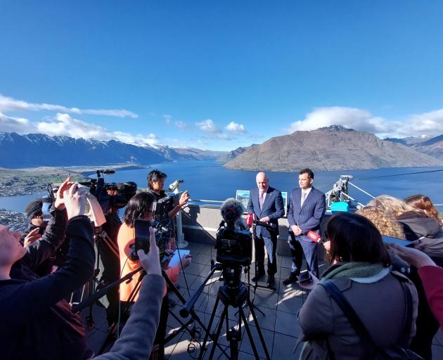 National Party leader Christopher Luxon stands with Southland MP Joseph Mooney during a policy ...
