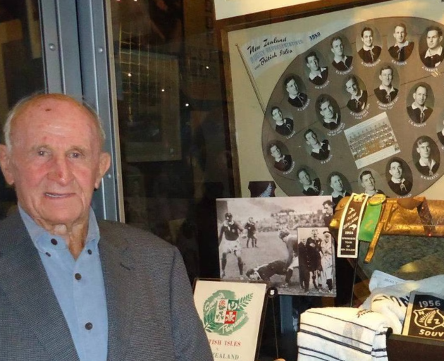 Roy Roper pictured standing in front of a photo of his 1950 All Blacks team at the New Zealand...