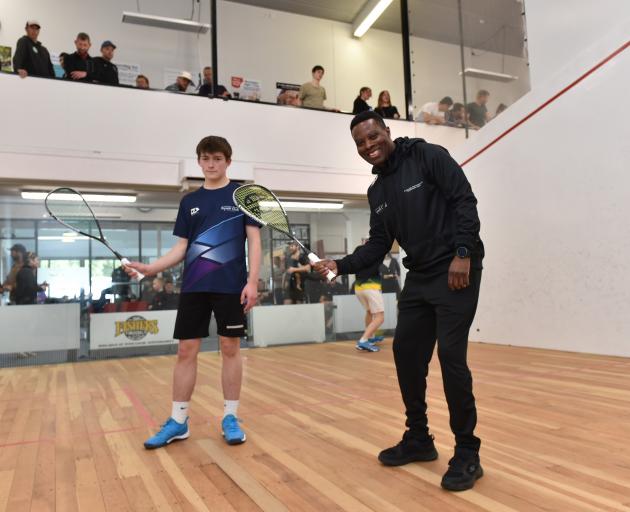 Evans Chileshe gives Riley Noonan (16) a few tips during the B grade national super championships...