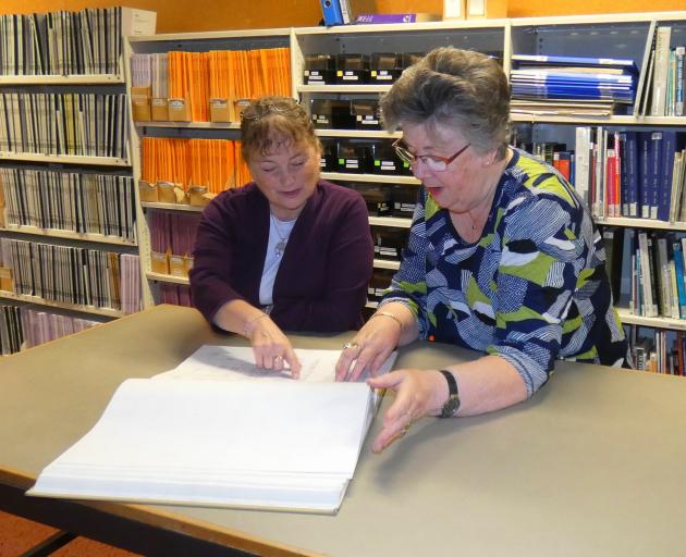 New Zealand Society of Genealogists Dunedin branch education officer Heather Bray (left) and...