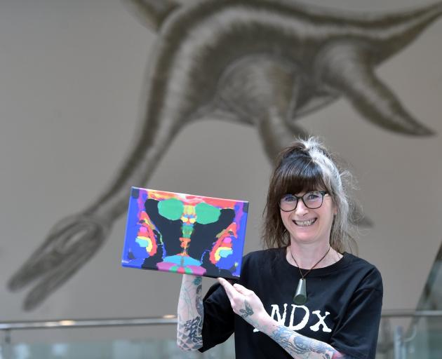 iNDx art exhibition co-founder Tanea Paterson with Indian Dacing Art Face, by Ebinezer Shodavaram...