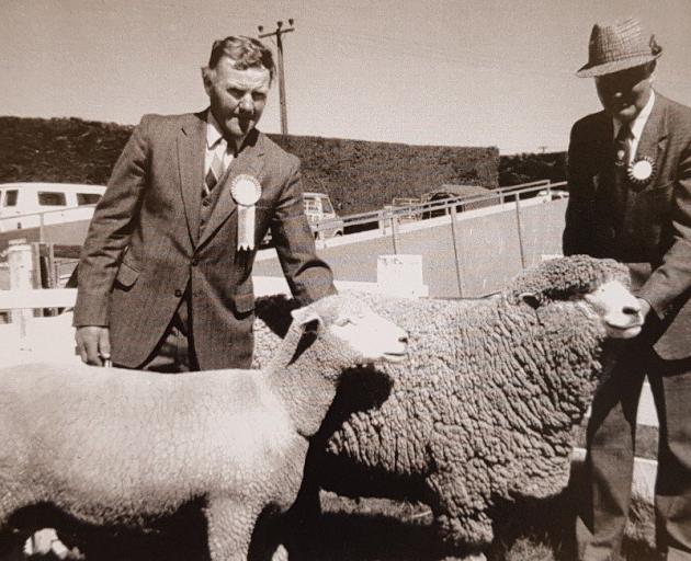 Neville Moorhead, left, with the champion Corriedale ewe and father Mac Moorhead with the...