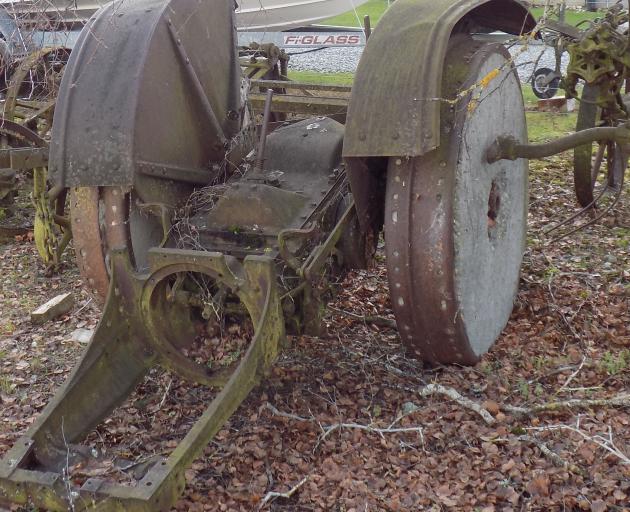 The remains of a McCormick-Deering tractor with its concrete-filled rear wheels which was used to...