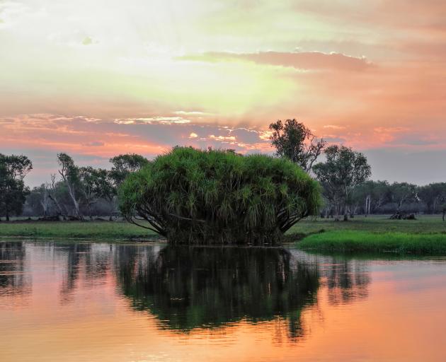 Sunset over Yellow Water/Ngurrungurrudjba Billabong, part of the South Alligator River floodplain...