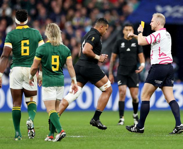 All Black Shannon Frizell leaves the pitch after being given a yellow card by the referee. Photo:...