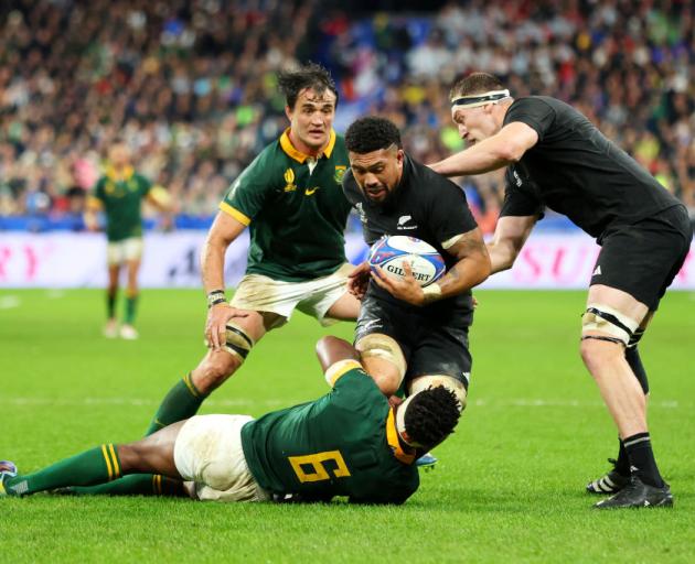 Ardie Savea is tackled by Springboks captain Siya Kolisi during the World Cup final. Photo: Getty...