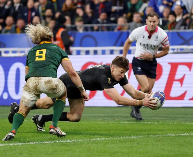 All Blacks fullback Beauden Barrett dives over to score the only try of the game in the second...