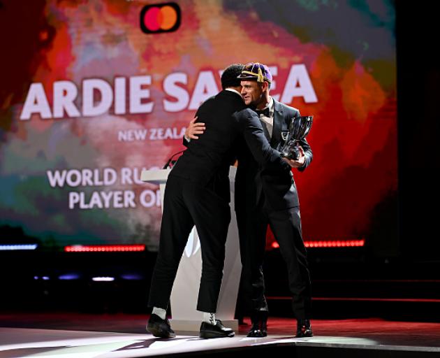 Ardie Savea receives his player of the year award from Dan Carter. Photo: Getty Images