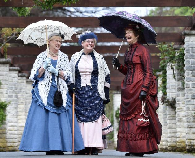 Historical costume makers (from left) Wilma Graham, Lorraine Clark and Helen Kay donned their...