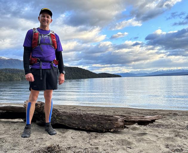 Simon Patton takes a breather at Lake Te Anau during his adventure completing Southland’s five...