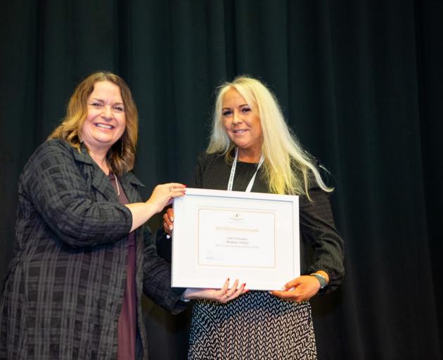 Minister of Education Jan Tinetti presenting Clare Erasmus with the honours award. Photo: Supplied
