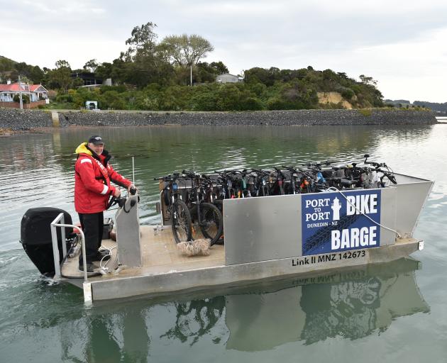 Kevin Waters, of Otago Moorings, pilots the Bike Barge on its maiden voyage from Port Chalmers to...