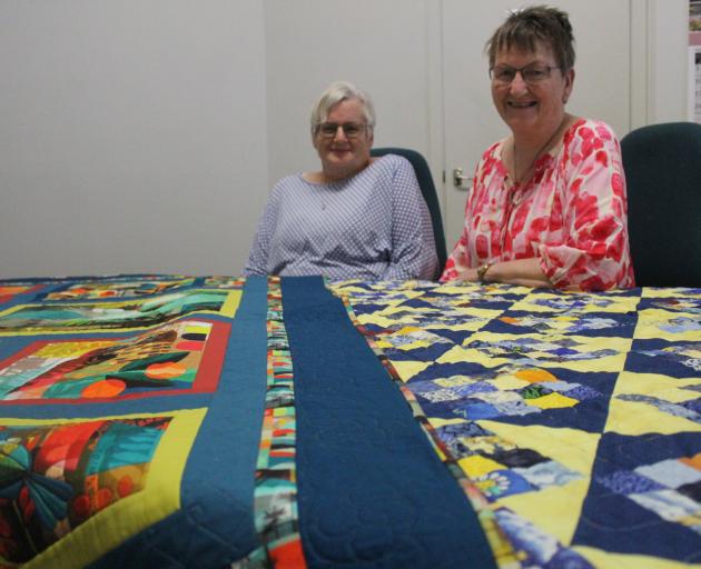 Otautau Patchworks Group Quilts and Cake exhibition secretary Joyce Wilson (left) and treasurer...