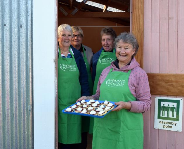 Catering for the sale are (from left) Barbara Blackler, of Knobby Range, Sue Beel, of Millers...
