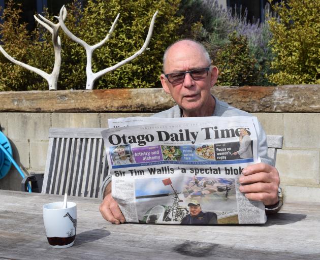 Retired deer farmer and scientist Tony Pearse reads an article on the death of his former...
