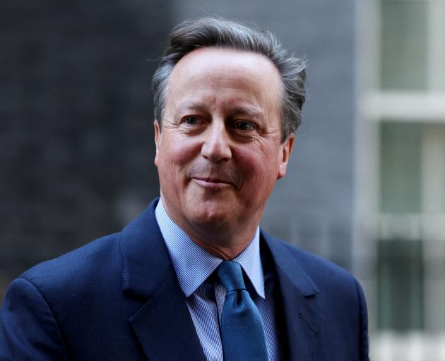 Britain's former Prime Minister and newly appointed Foreign Secretary David Cameron outside 10...