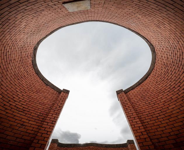 The curved brick screens hiding equipment on the roof of Aurora Energy’s Vogel St substation are...
