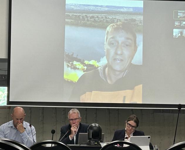 Commissioners (below, from left) Craig Welsh, of Nelson, Rob van Voorthuysen (chairman), of...