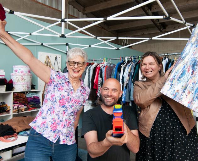 Elim Alexandra pastors Sarah (right) and Aaron More, alongside Michelle Whitney, display some of...