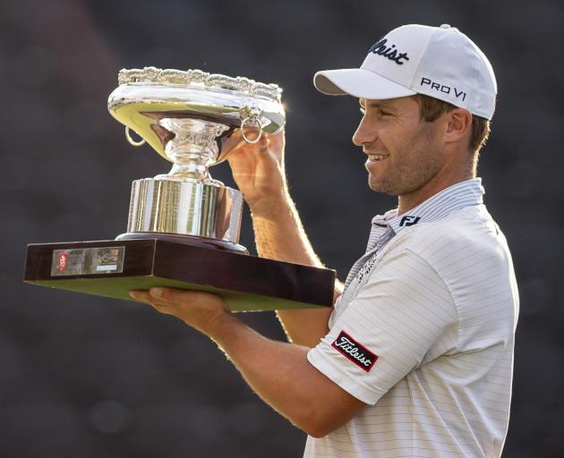 Ben Campbell of New Zealand poses for photo with trophy after winning the final round of the...