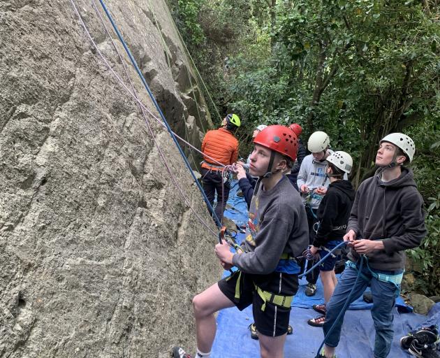 Otago Boys’ High School climbers Billy Gilchrist (red helmet) and James Hulyer (white) assess the...