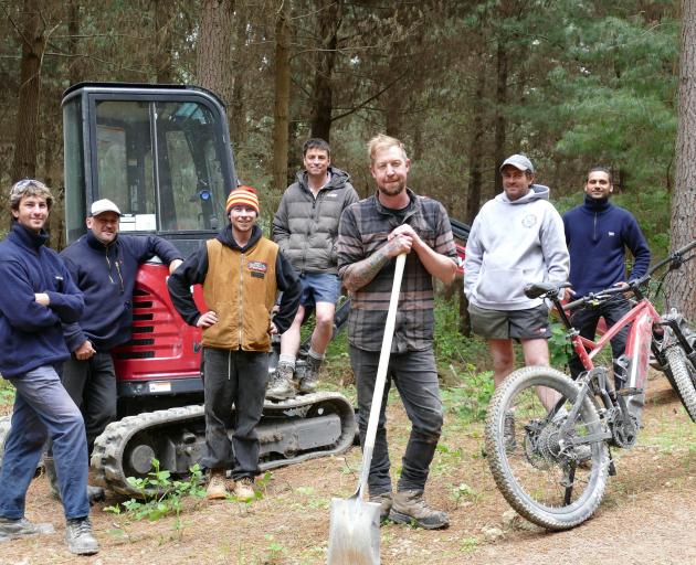 Lawrence Bike Club (LBC) members and Flux Trail trail-building consultants (from left) Jacob O...