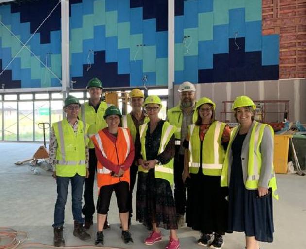 Top right – Putahi board and senior management team in the new senior school hall. Back row:...