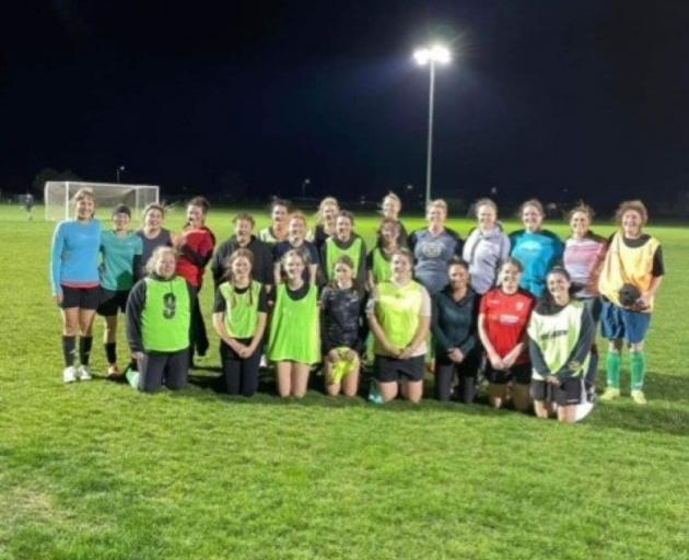 Alexandra and Cromwell women's football teams after a friendly match at Cromwell. The women want...