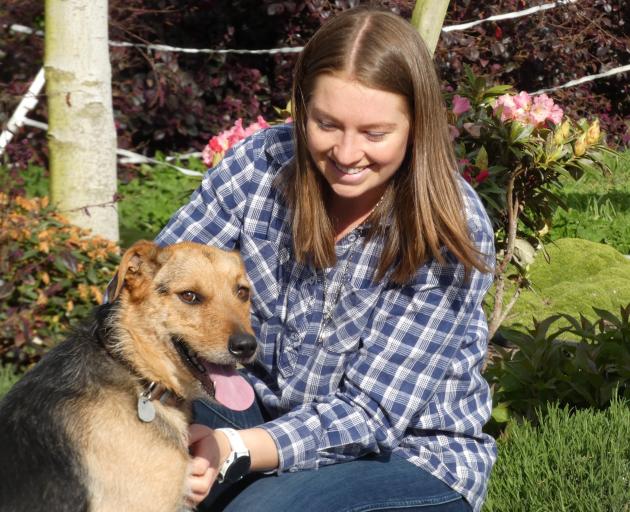 Anzco Food’s Harriet Watson with canine company at her family’s farmlet between Canterbury’s...
