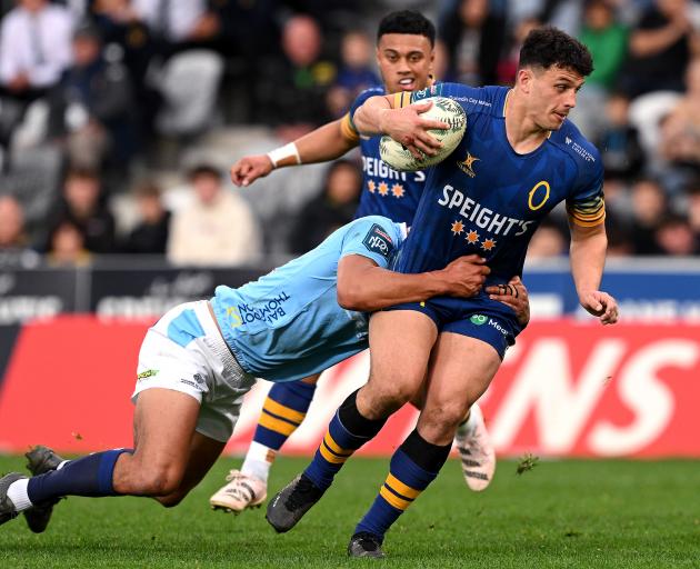Young Otago backs Jake Te Hiwi (with ball) and Ajay Faleafaga will tomorrow be named in the...