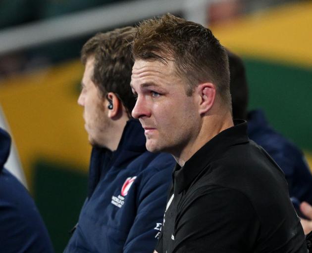 Sam Cane sits on the sideline at the Rugby World Cup final after getting a red card. Photo: Getty...