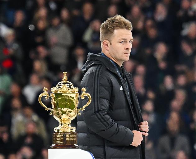 A dejected Sam Cane walks past the Webb Ellis Cup. He was the first player to be sent off in a...