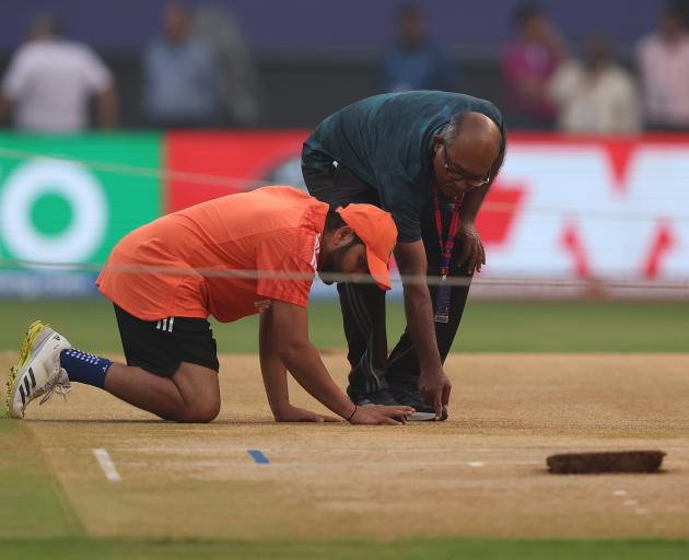 India's Rohit Sharma inspects the pitch at Wankhede Stadium. Photo: Getty Images