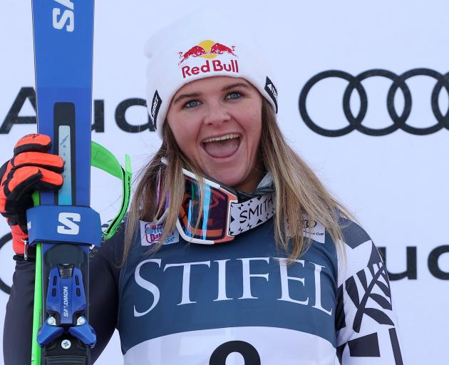Queenstown skier Alice Robinson reacts on the podium after finishing second at the FIS giant...