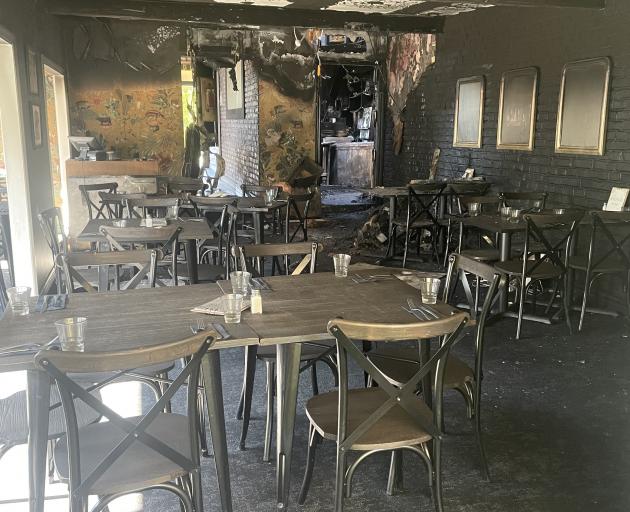 The fire at Black Door Bar and Eatery in August left the dining area badly damaged by smoke and...