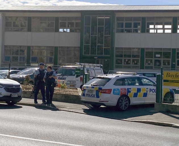 Armed police at the entrance to Bayfield School. Photo: Craig Baxter