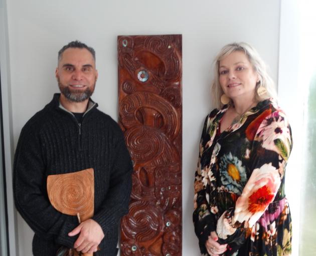 Te Pākihi o Maru school principal Stacey Honeywell and taonga carver Jackson Grey stand beside...