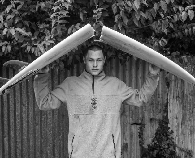 Ollie Charlesworth, of Dunedin, with his favourite surfboard.