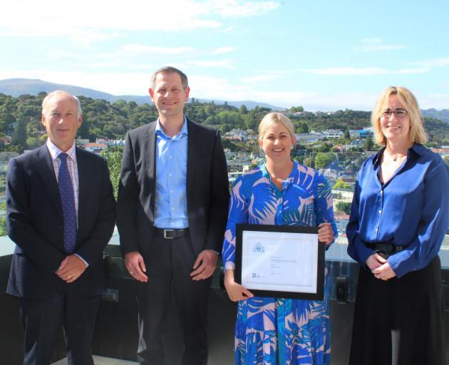 Ross Buckley and Trish Oakley flank Institute of Directors Otago-Southland branch emerging...