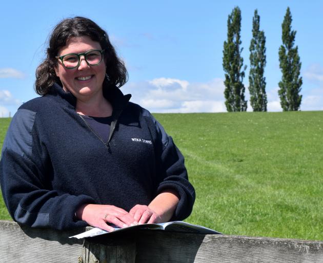 Otago South River Care project co-ordinator Rebecca Begg reads the booklet Start Your Own Farm...