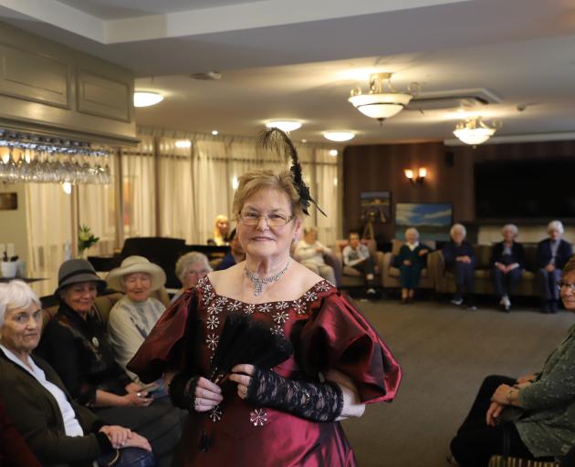 Historical costumier Lorraine Clark shows off one of her creations during a showcase of Regency,...