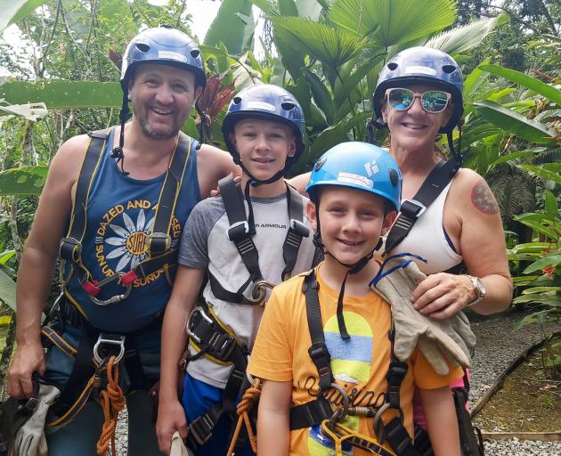Fraser and Jane Tyrrell and sons Archie and Tana preparing to zipline through the Costa Rican...