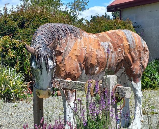 A corrugated iron Clydesdale stallion is one of the many features in the garden of Brookfield...