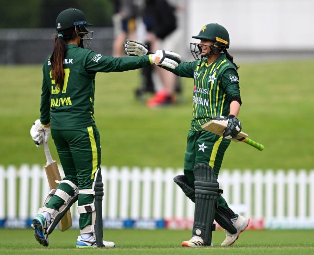 Bismah Maroof (right) and Aliya Riaz of Pakistan celebrate after winning the first match of the...