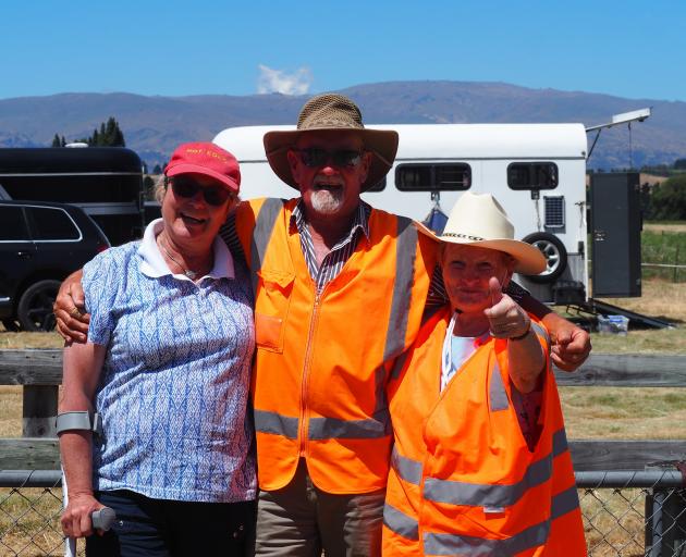 Volunteering at the races are (from left) Jill Henry, Doug Brenssell and Shorty Gray.