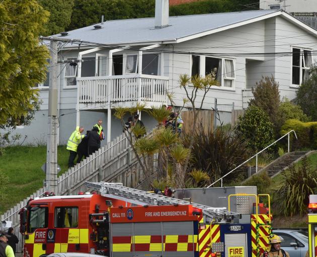 Emergency services attend a house fire in Mulford St in Concord about 6pm on Saturday. PHOTO:...