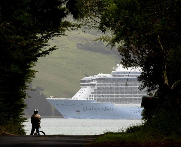 Cruise ship Ovation of the Seas glides up Otago Harbour past Harwood yesterday. PHOTOS: GERARD O...